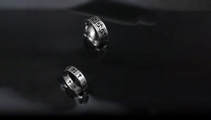 2 rings sit in a black melted pool